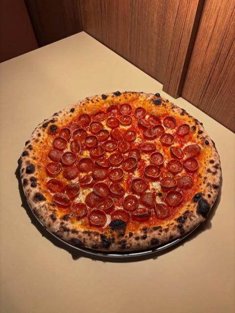 Pepperoni pizza with tomato base, mozzarella and parmesan